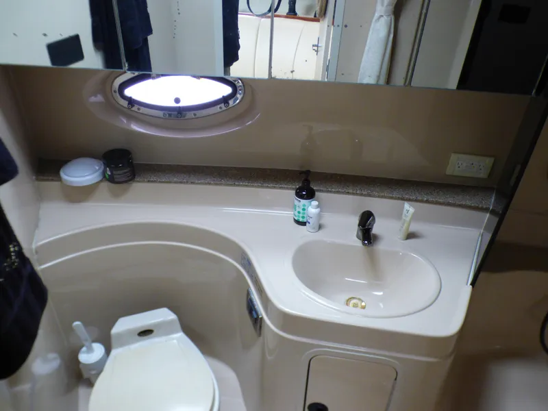 2001 Cruisers Yachts 340 Express bathroom with sink and toilet.