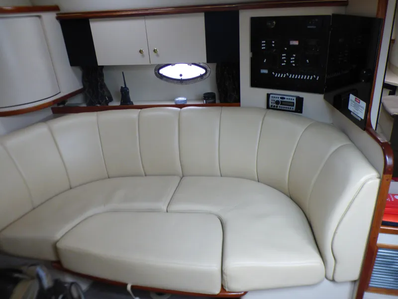 Interior of 2001 Cruisers Yachts 340 Express with leather sofa.