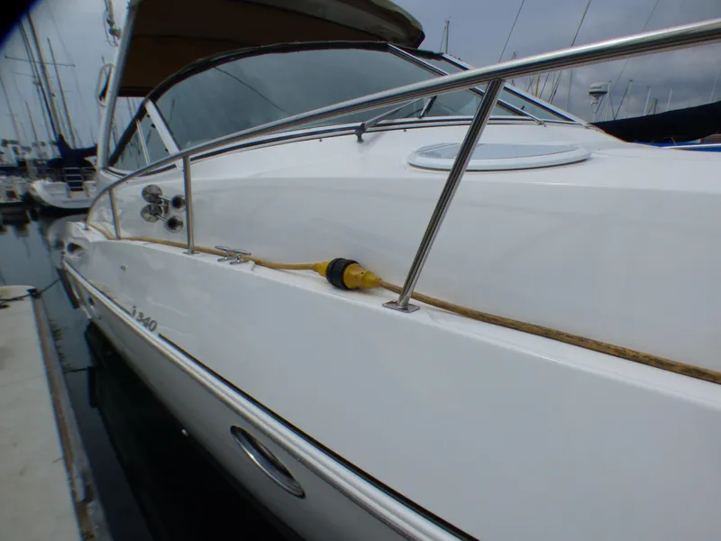 2001 Cruisers Yachts 340 Express docked at marina.
