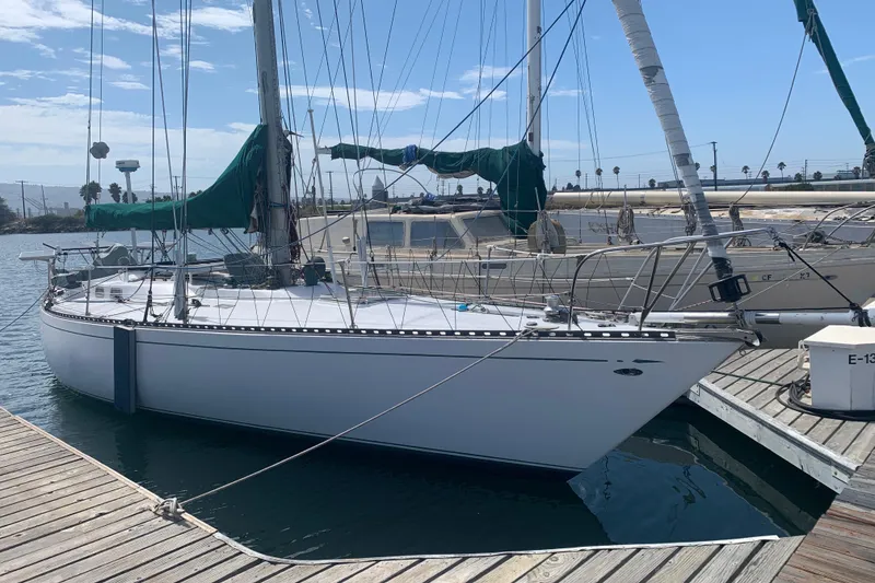 1972 Tartan 41 sailboat docked at marina under clear blue sky.