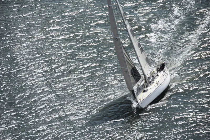 Vintage 1972 Tartan 41 sailboat navigating sparkling waters.