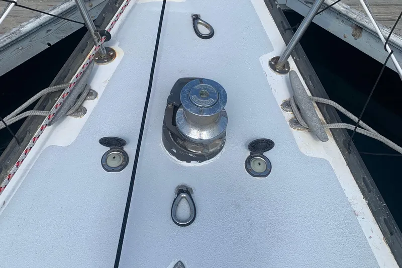 Deck of 1972 Tartan 41 sailboat with winch and cleats.
