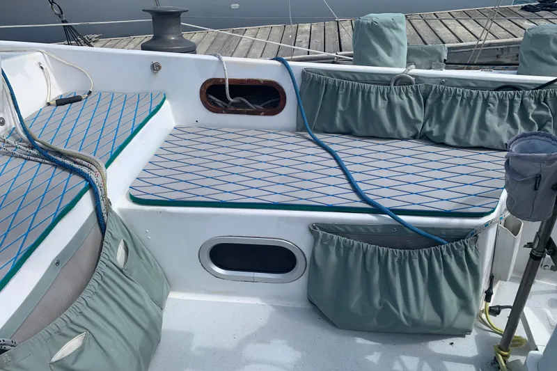 Cockpit of 1972 Tartan 41 sailboat with cushioned seating and storage pockets.