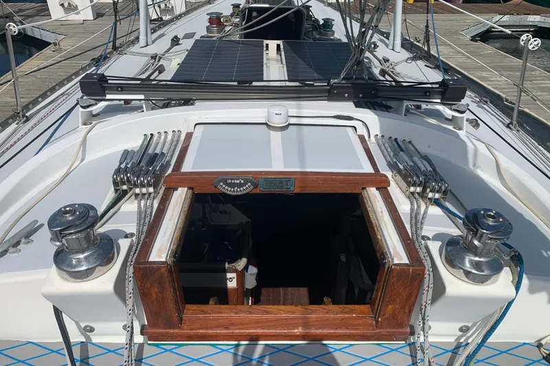 1972 Tartan 41 sailboat deck with winches, ropes, and open cabin hatch.