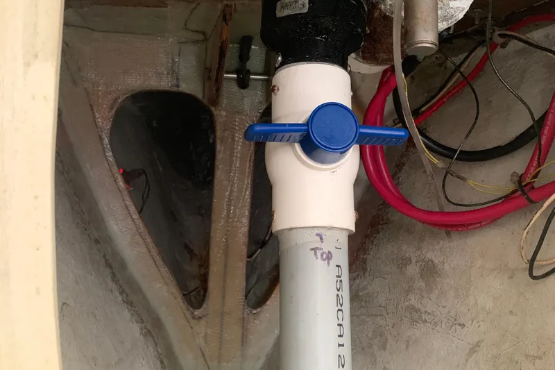 Plumbing valve and wiring inside a 1972 Tartan 41 boat.