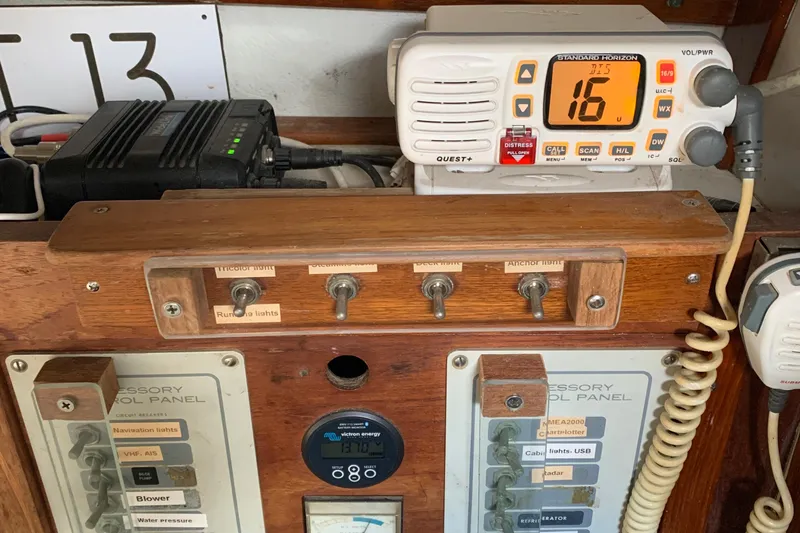 Control panel of a 1972 Tartan 41 sailboat with radio and switches.