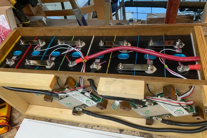 Battery setup inside a 1972 Tartan 41, featuring wiring and connectors.