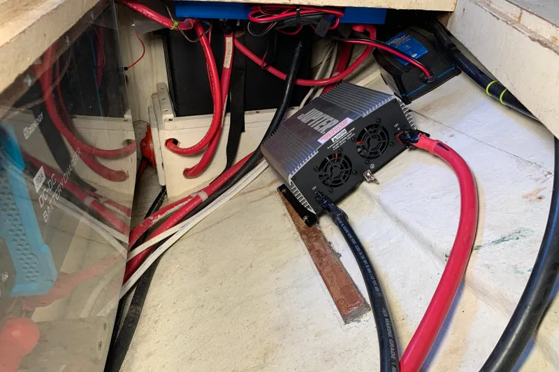 Electrical setup in a 1972 Tartan 41 sailboat with battery charger and wiring.