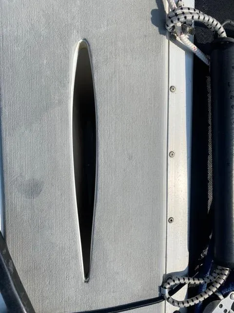 Close-up of a 1989 Nacra 5.8 catamaran deck with rigging details.