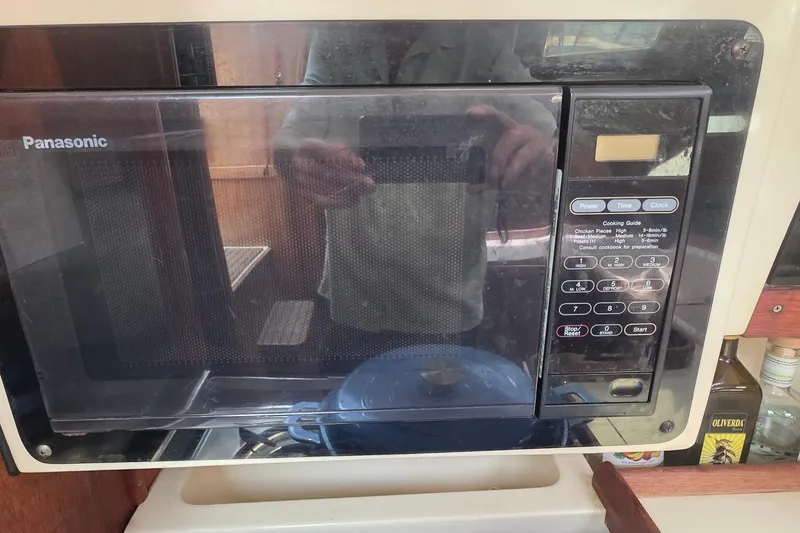 Panasonic microwave in a 1995 Hunter 336 yacht kitchen setting.