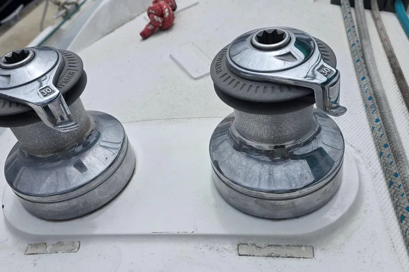 Winches on a 1995 Hunter 336 sailboat deck with ropes and fittings.