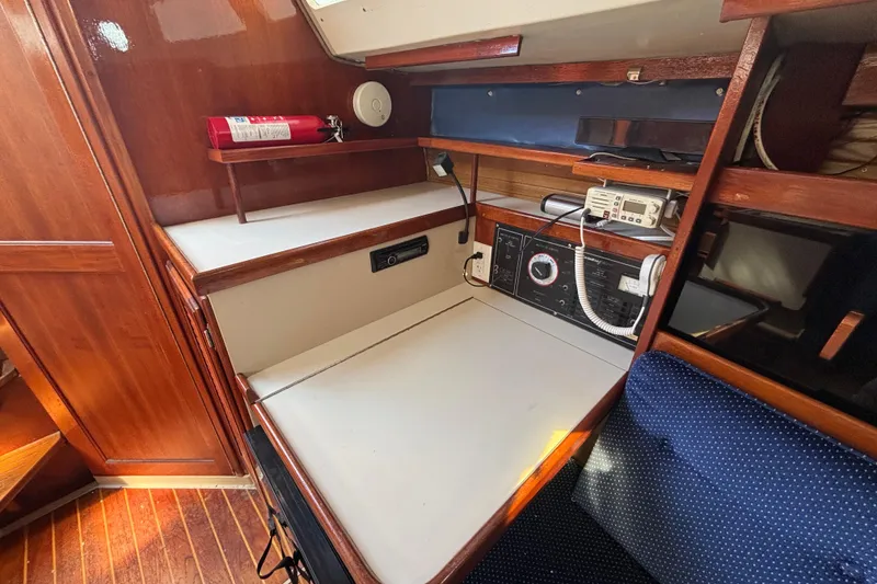 1988 Catalina 34 yacht interior with navigation station and wooden cabinetry.