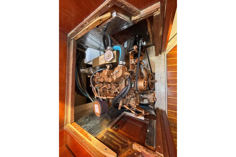Engine compartment of a 1988 Catalina 34 sailboat, showcasing detailed mechanical components.