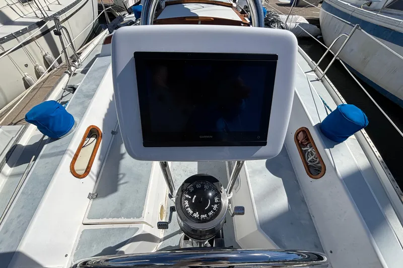 Cockpit of 1988 Catalina 34 sailboat with Garmin navigation display and compass.