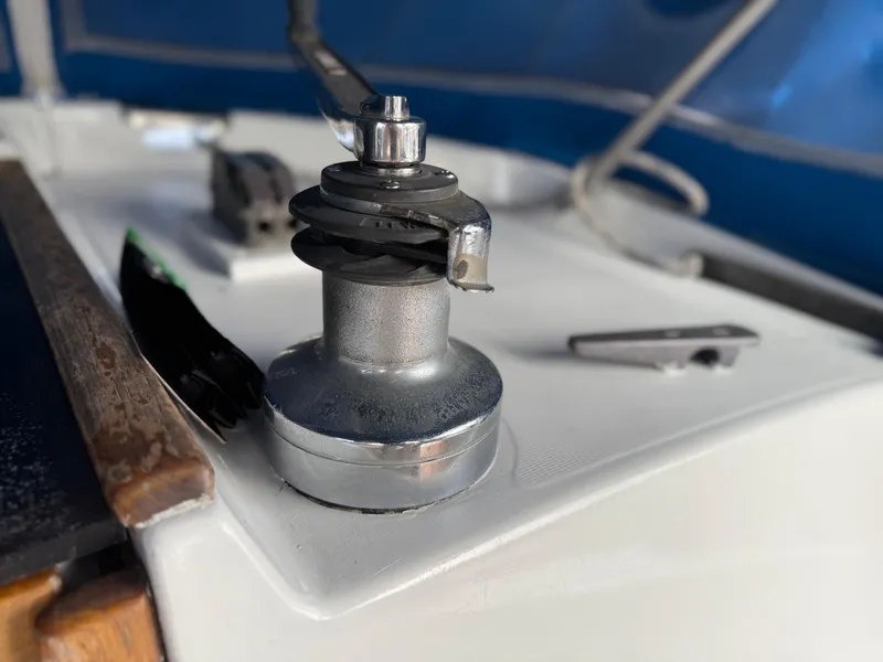 Winch on 1986 Beneteau Idylle 15.50 sailboat deck, close-up view.