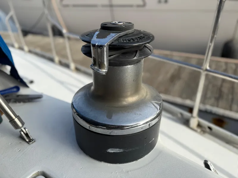Winch on 1986 Beneteau Idylle 15.50 sailboat deck, close-up view.