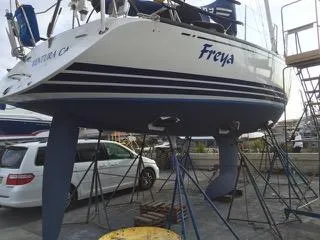 2002 X-Yachts X-382 sailboat "Freya" on stands in a marina.