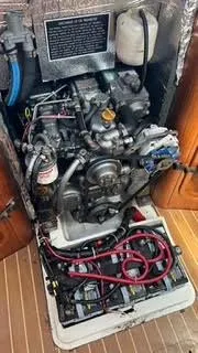 Engine compartment of a 2002 X-Yachts X-382 sailboat, showcasing mechanical components and wiring.