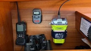 Navigation equipment on X-Yachts X-382, 2002 model, featuring radio, EPIRB, and binoculars.
