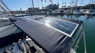 Solar panel on 2002 X-Yachts X-382 sailboat in marina setting.