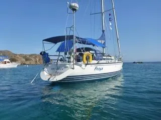2002 X-Yachts X-382 sailboat anchored in clear blue water.
