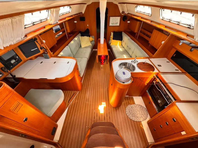 Luxurious interior of 2002 X-Yachts X-382 sailboat with wood finish and modern amenities.