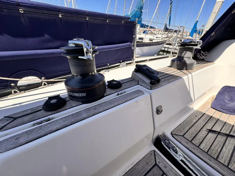 Deck view of 2002 X-Yachts X-382 sailboat with winches and wooden flooring.
