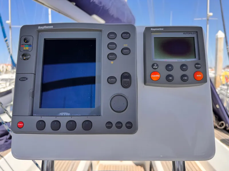 Control panel on a 2002 X-Yachts X-382 sailboat, featuring navigation and autopilot systems.
