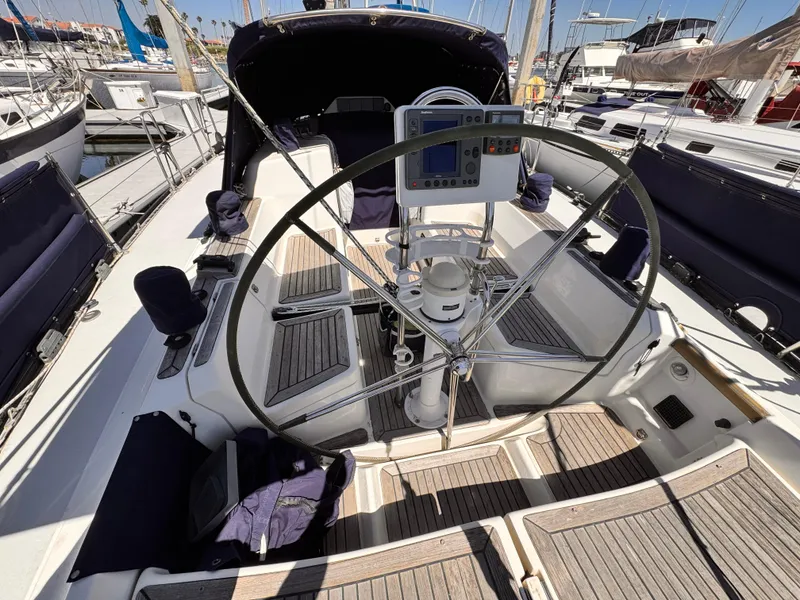 Cockpit of 2002 X-Yachts X-382 sailboat with steering wheel and navigation equipment.