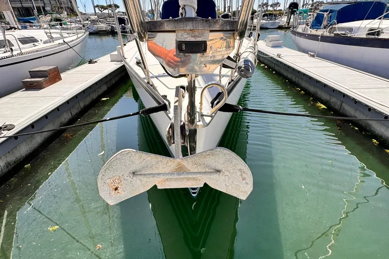 2002 X-Yachts X-382 sailboat docked in marina, front view with anchor visible.