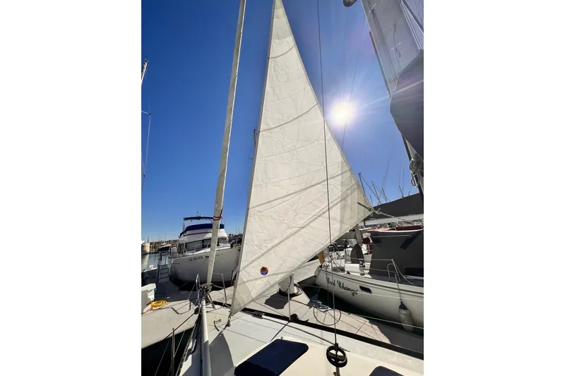 Sailboat X-Yachts X-382, 2002 model, docked under clear blue sky.
