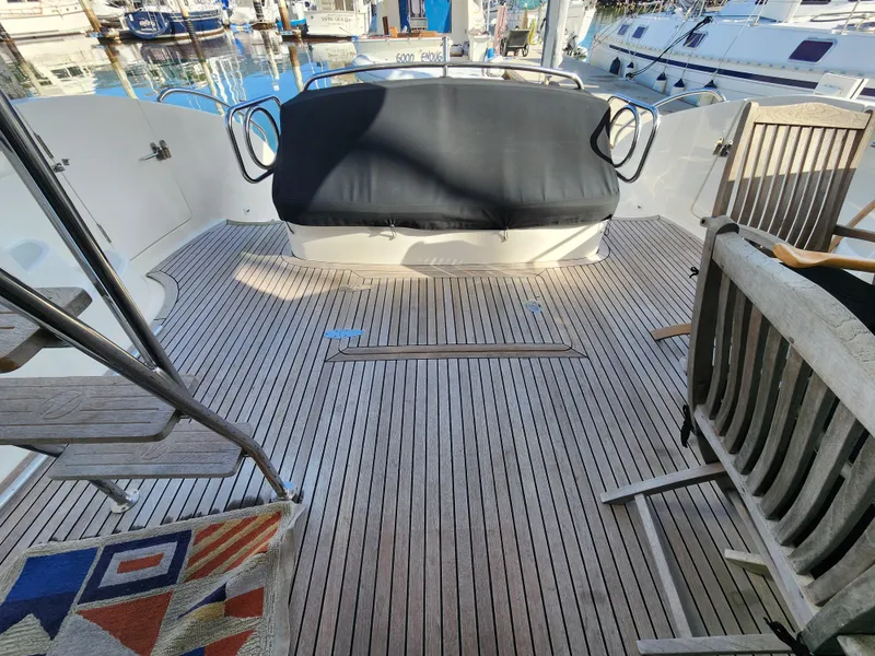 2007 Ocean Alexander Veloce yacht deck with wooden flooring and seating area.