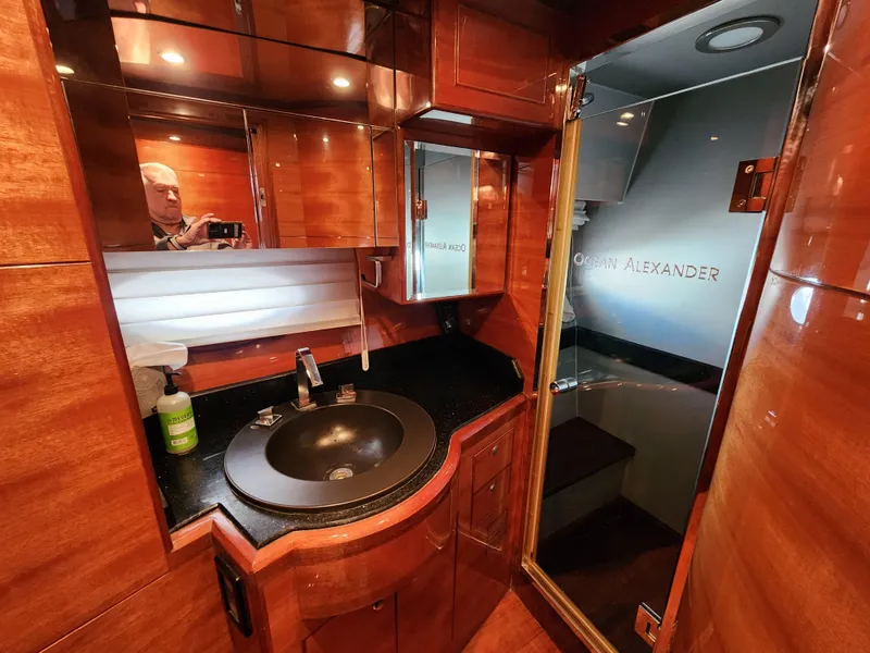 Luxurious 2007 Ocean Alexander Veloce yacht bathroom with wood finish and modern fixtures.