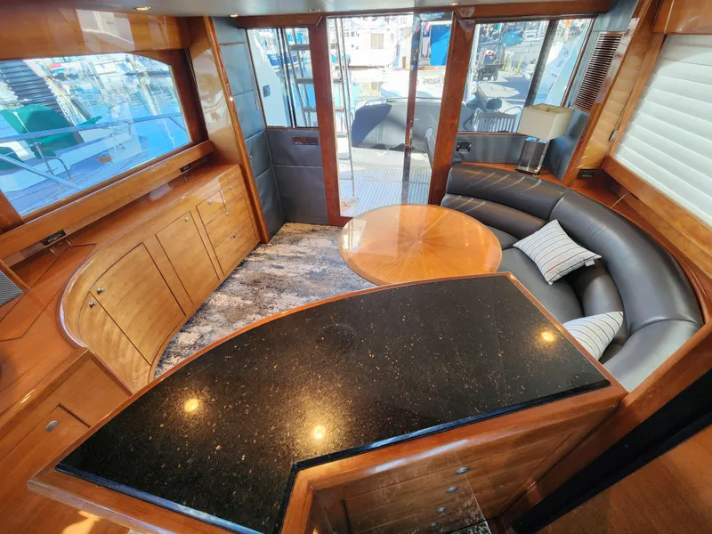 Luxurious 2007 Ocean Alexander Veloce yacht interior with elegant wood finishes and modern seating.