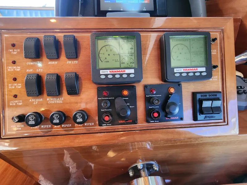 Control panel of a 2007 Ocean Alexander Veloce yacht with Yanmar displays and switches.