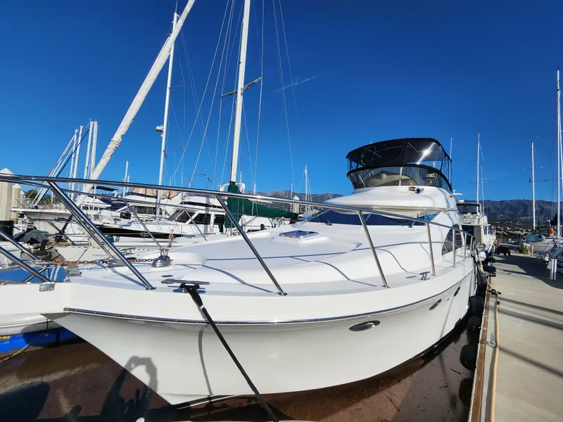 2007 Ocean Alexander Veloce yacht docked at marina under clear blue sky.