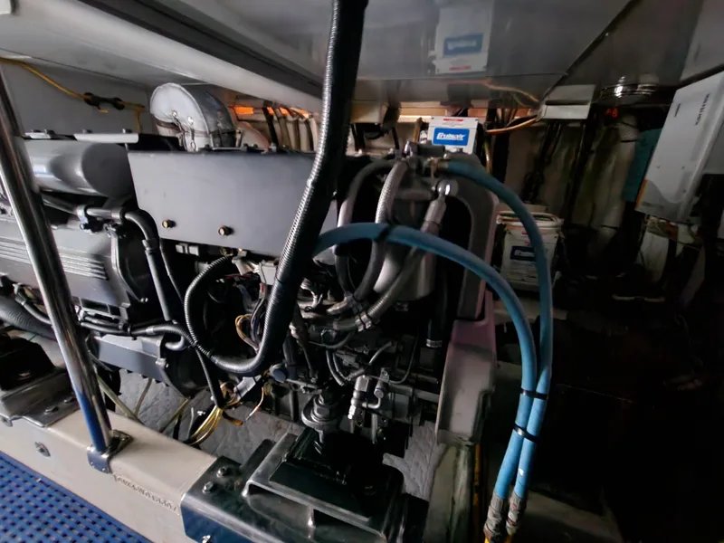 Engine room of 2007 Ocean Alexander Veloce yacht, showcasing complex machinery and wiring.