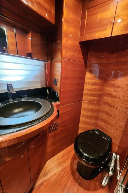 Luxurious 2007 Ocean Alexander Veloce yacht bathroom with wood paneling and modern fixtures.