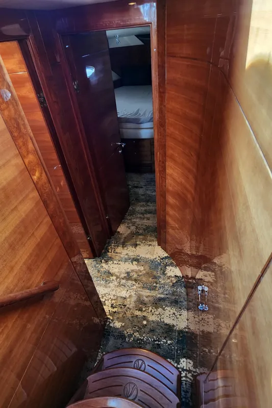 Luxurious wooden interior of 2007 Ocean Alexander Veloce yacht hallway.