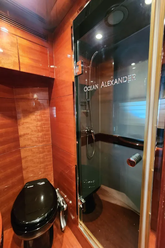 Luxurious bathroom in 2007 Ocean Alexander Veloce yacht with sleek wood finish and modern fixtures.