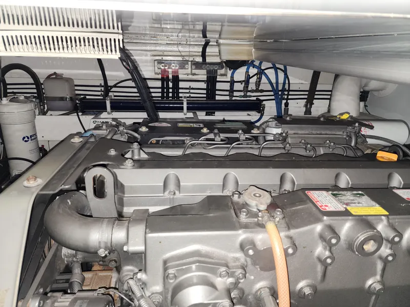 Engine room of 2007 Ocean Alexander Veloce yacht, showcasing mechanical components and wiring.