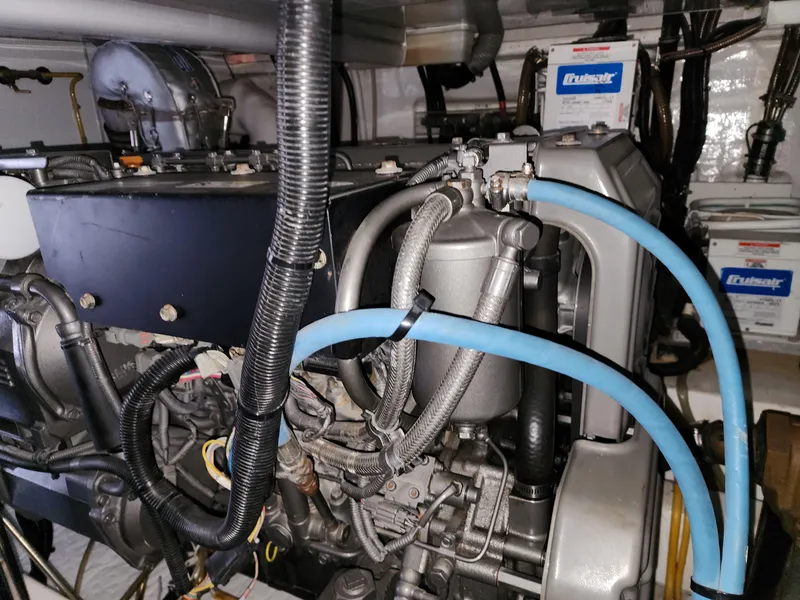 Engine room of 2007 Ocean Alexander Veloce yacht, showcasing complex machinery and wiring.