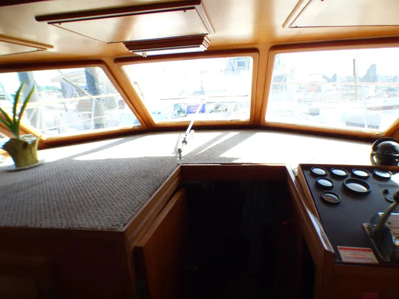 1984 Spindrift 39 ft. Aft Cabin Twin Diesel interior helm with panoramic windows and control panel.