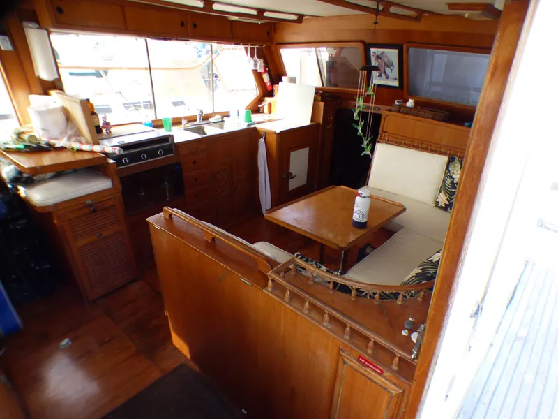 1984 Spindrift 39 ft. Aft Cabin interior with wood finish and cozy seating area.