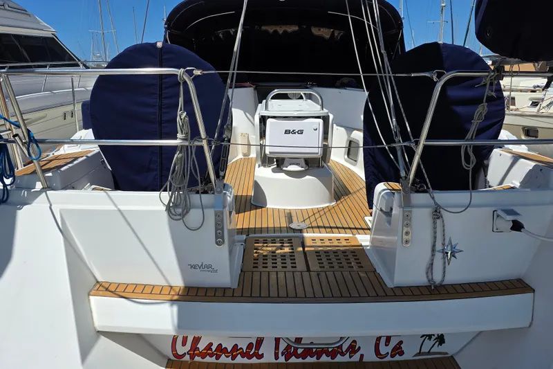 2007 Jeanneau 49 Performance sailboat cockpit with teak flooring and covered seating.