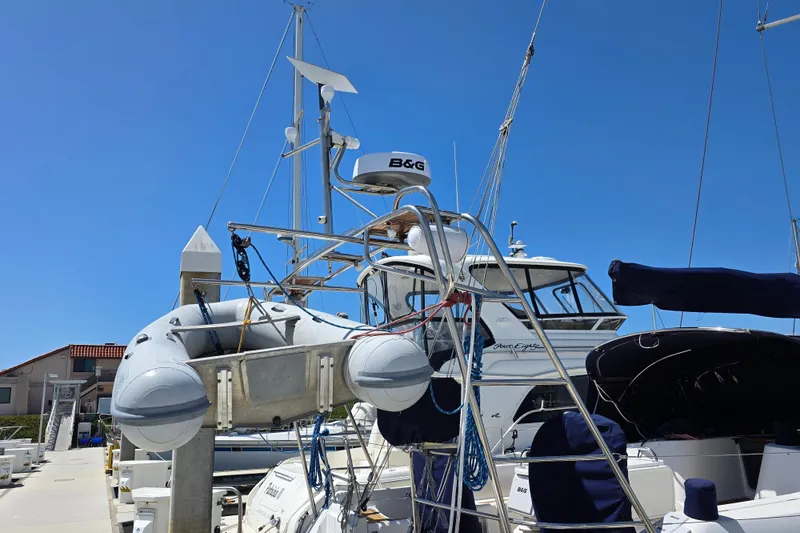 2007 Jeanneau 49 Performance sailboat docked with inflatable dinghy and radar equipment.