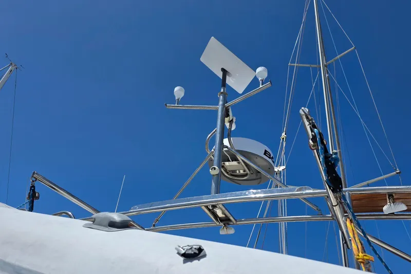 Sailboat equipment on Jeanneau 49 Performance, 2007 model, under clear blue sky.