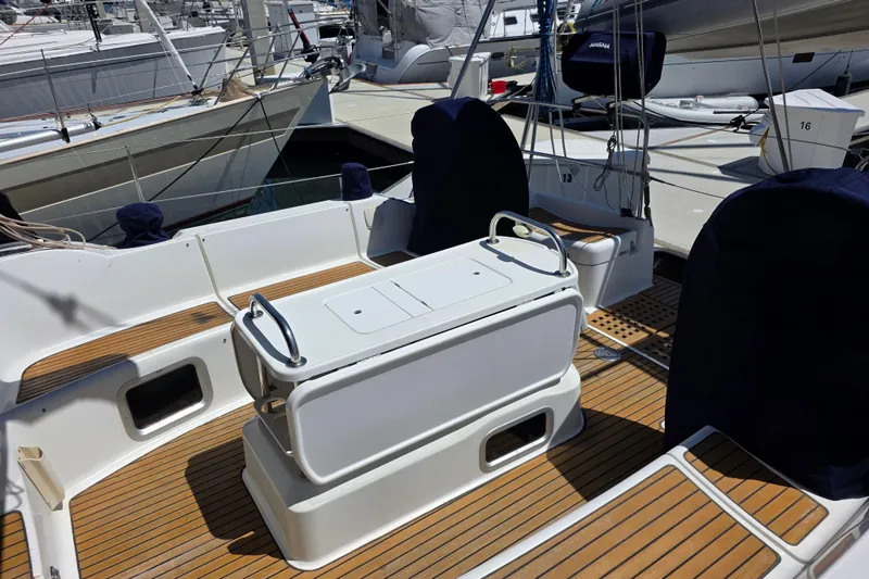2007 Jeanneau 49 Performance yacht cockpit with teak flooring and covered seating.