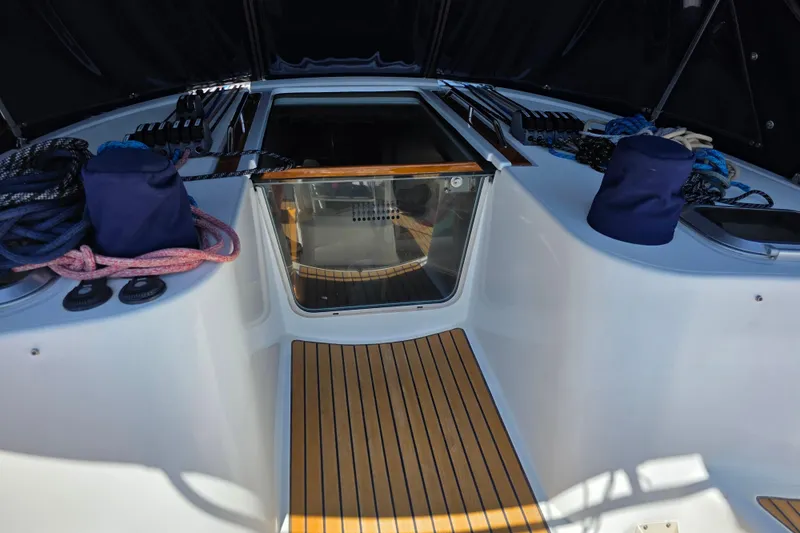 2007 Jeanneau 49 Performance yacht cockpit with ropes and wooden flooring.