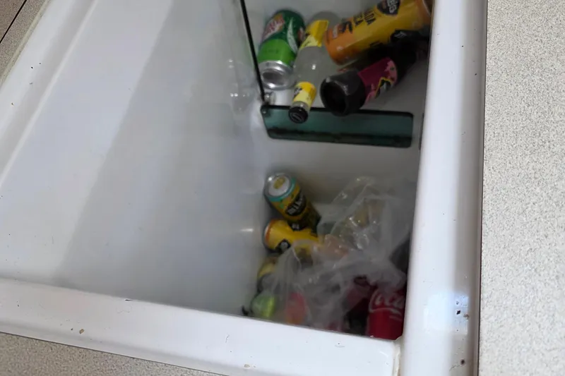 Cooler with assorted beverage cans on Jeanneau 49 Performance, 2007 model.
